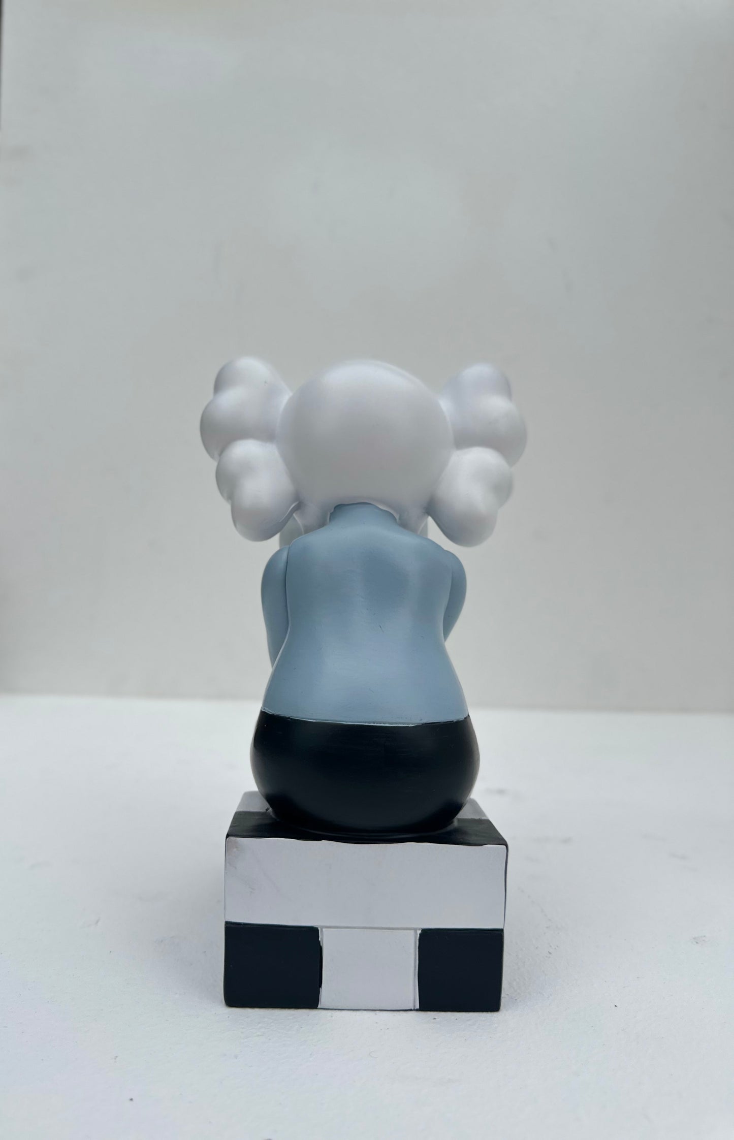 Small sitting Kaws doll
