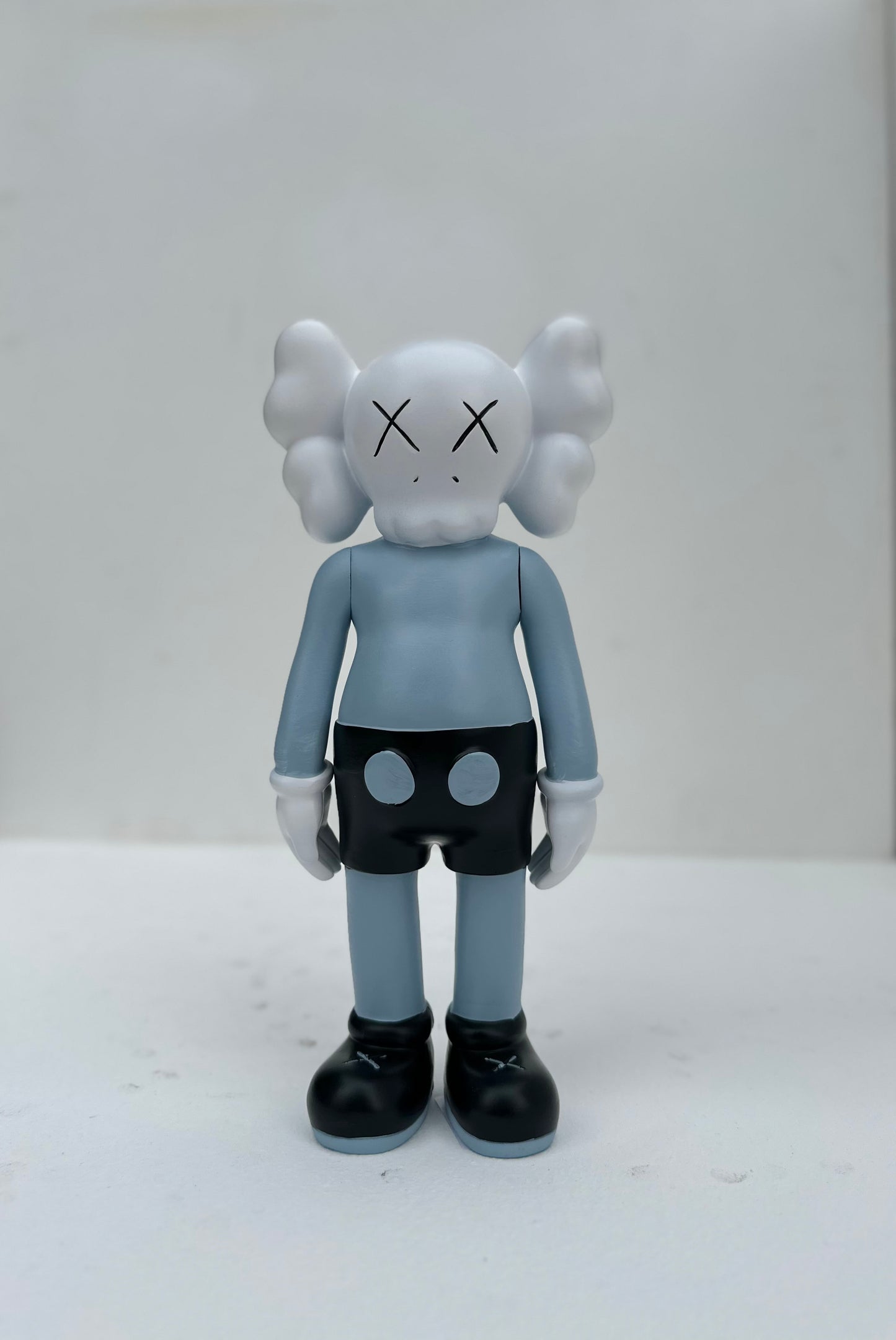 Small standing Kaws doll