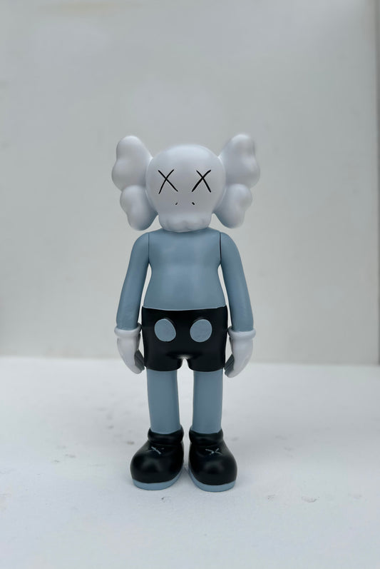 Small standing Kaws doll