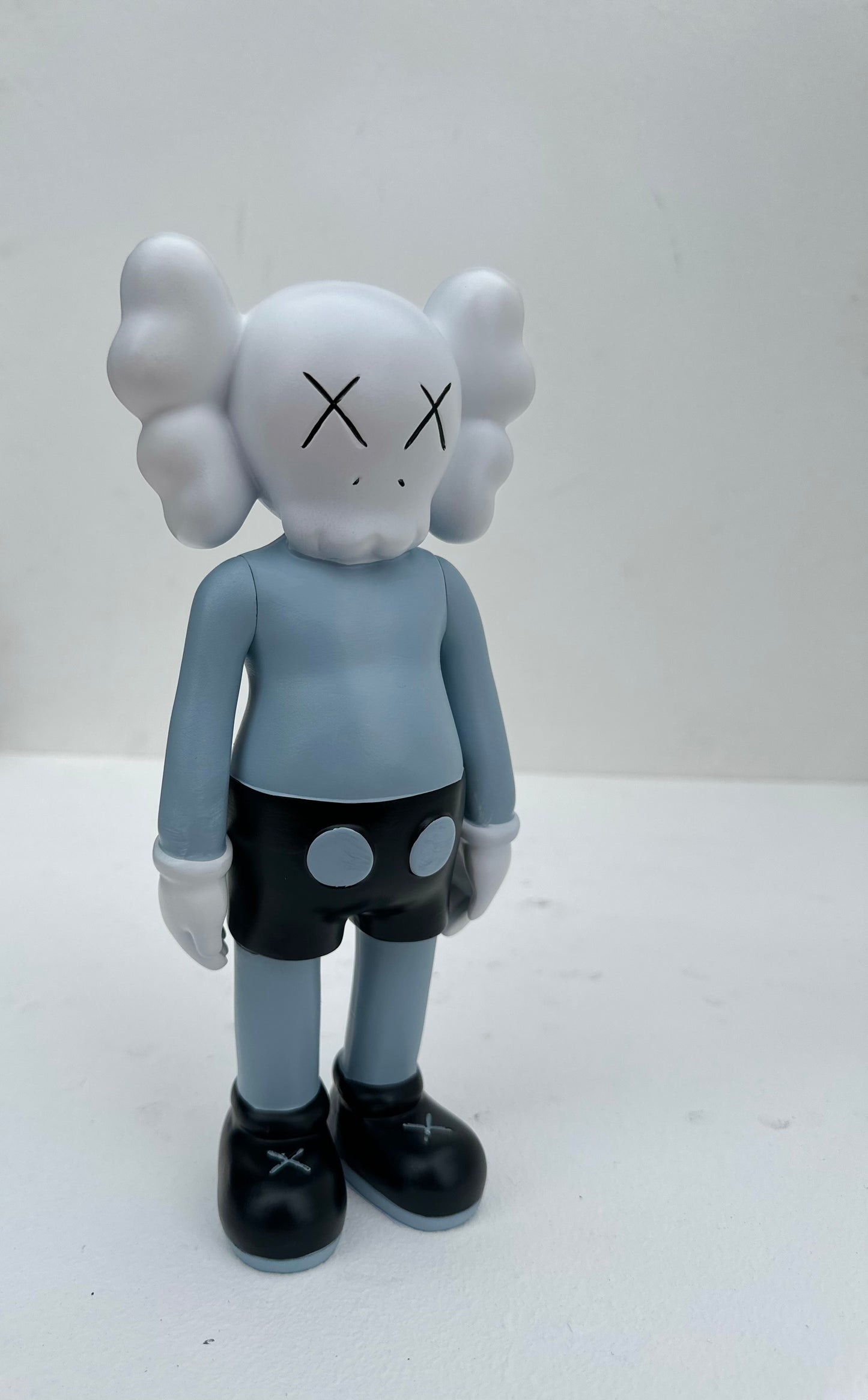 Small standing Kaws doll