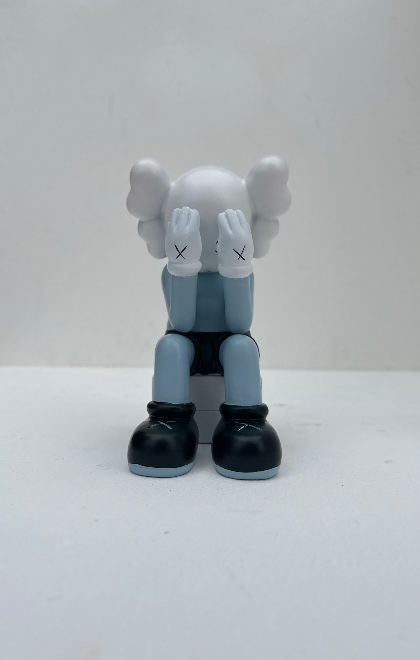 Small sitting Kaws doll