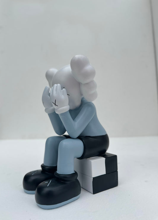 Small sitting Kaws doll